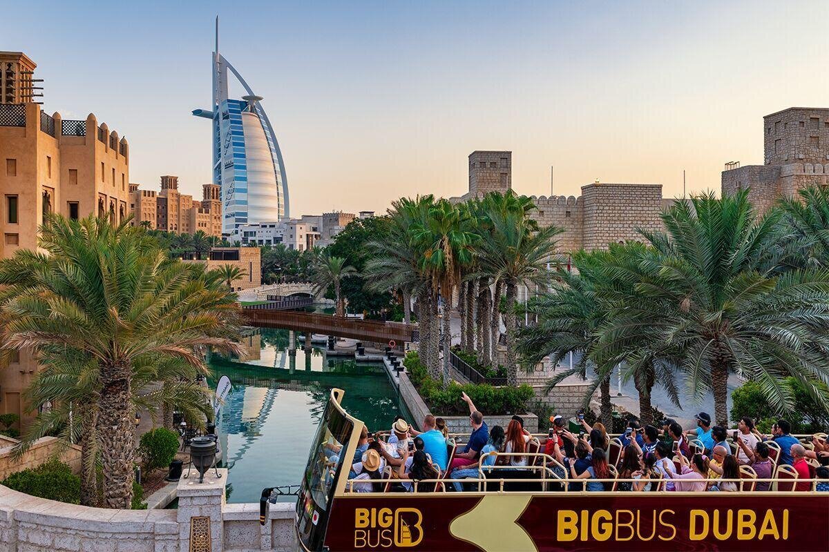 Big Bus Tours in Dubai passing the Burj Khalifa with views of futuristic skyscrapers, Dubai Marina, and desert cityscapes