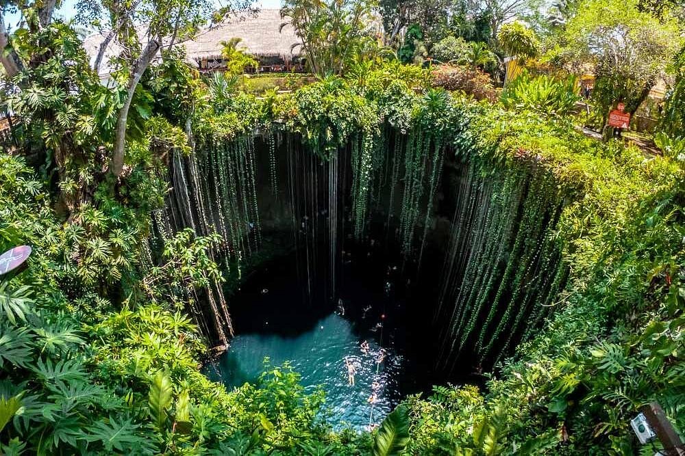 Chichen Itza 2 tourist swimming in Cenote Ik Kil near Chichen Itza.