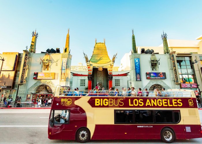 Big Bus Tours in Los Angeles driving through Hollywood with views of the Walk of Fame, Sunset Strip, and the Hollywood Sign in the distance