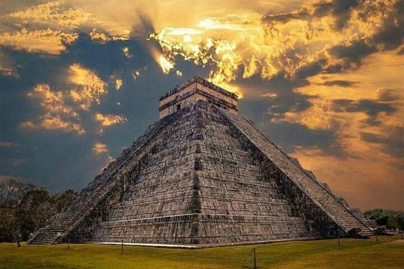 guided tour of Chichen Itza with view of El Castillo pyramid at sunset.