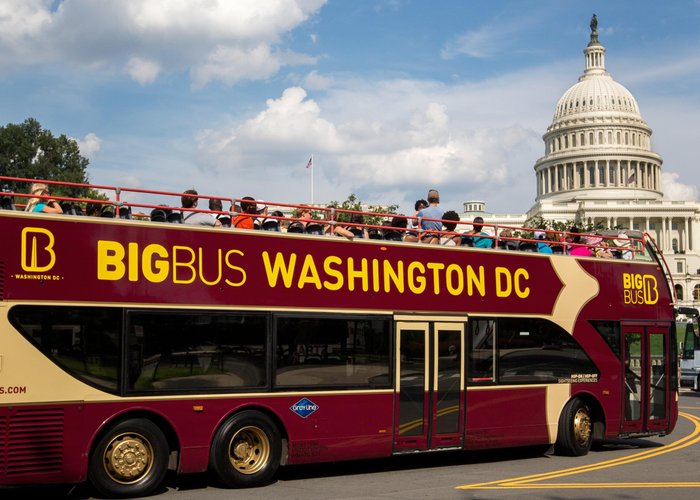 Big Bus Tours in Washington DC passing the U.S. Capitol and National Mall with views of iconic monuments and cherry blossom-lined streets