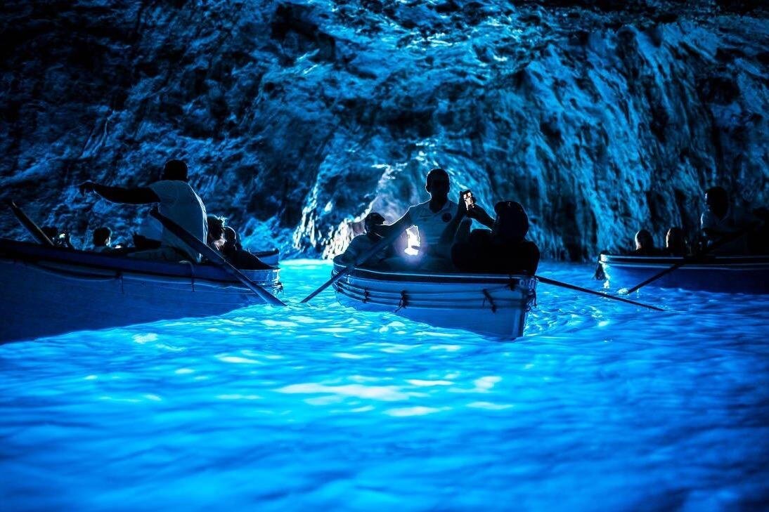 Blue Grotto and Faraglioni Boat Tour – Sail through sea caves and beneath the iconic rock arches on a luxurious small-group cruise.