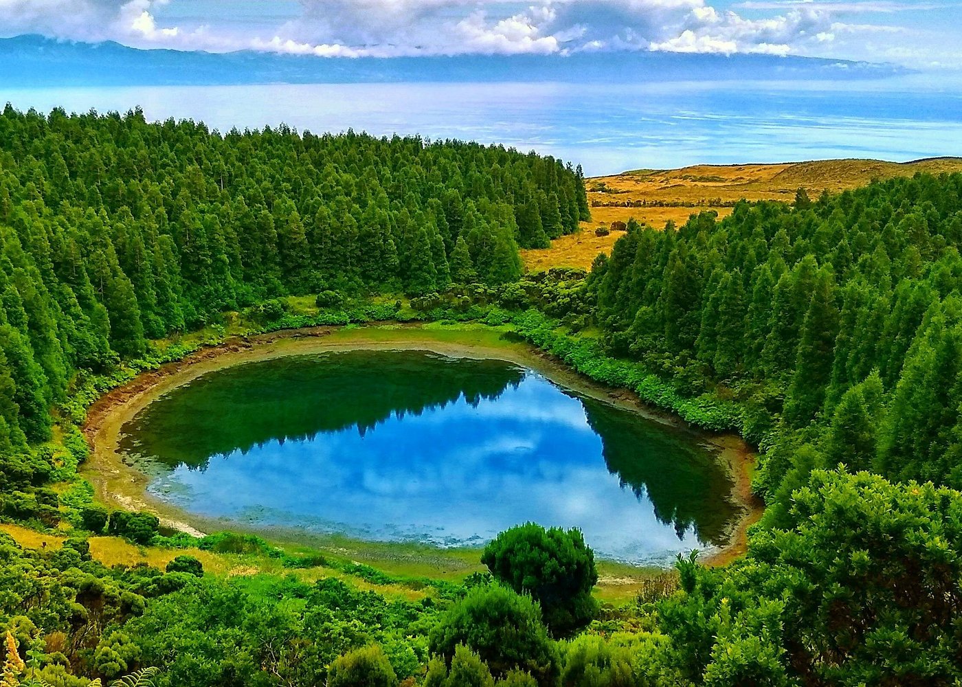 Serenity Uncovered: Peaceful Retreats & Tranquil Journeys 12 Pico Island, Azores: Vineyards amid volcanic landscapes and ocean vistas.