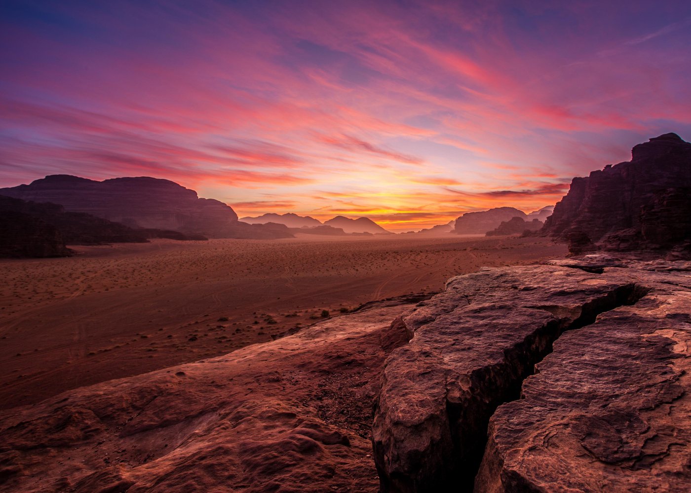 colored sands and stark rock formations of Wadi Rum make this desert wilderness a must-visit