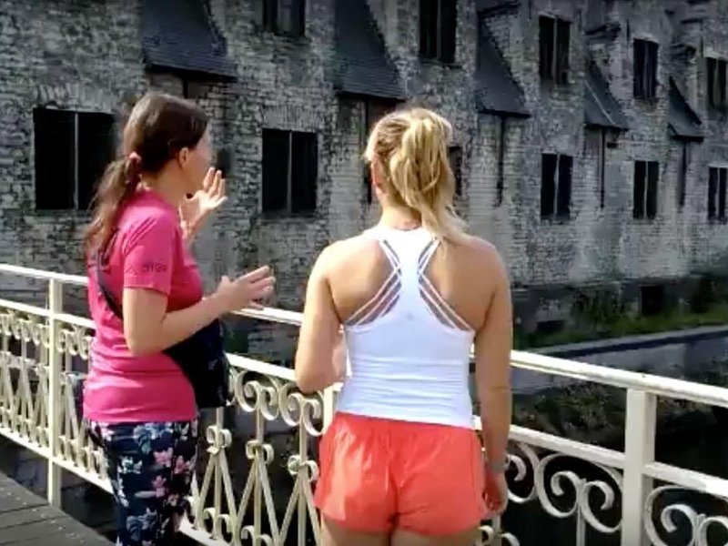 Explaining the history of the Butcher's Hall.