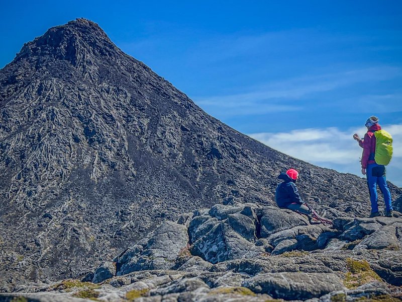 Pause before the final push to Mount Pico's summit.