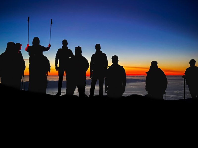 First light after a night climb — unforgettable moments above the clouds.