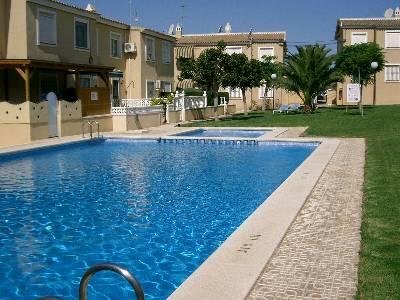 Communal pool and lush gardens