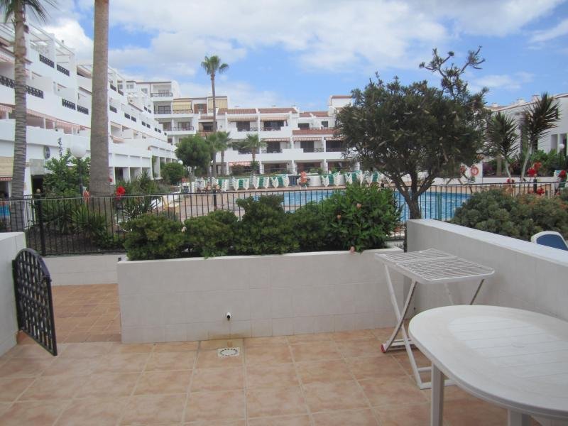 Sitting on the patio facing the Pool