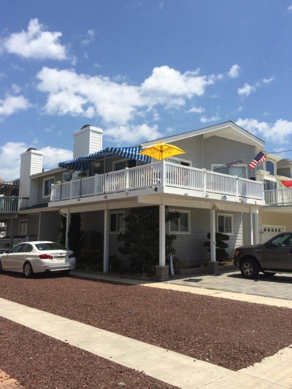 big private wrap around deck with parking for up to 4 vehicles in the front