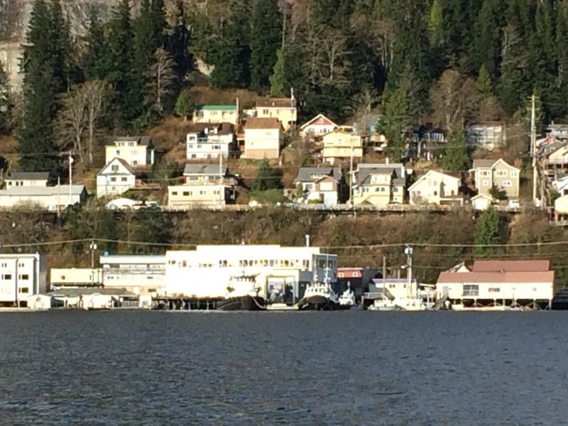 Look at the top left corner! cute yellow  house with green roof top. 