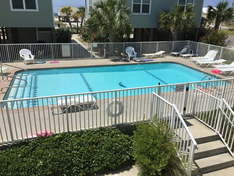 Beautiful pool steps to the beach
