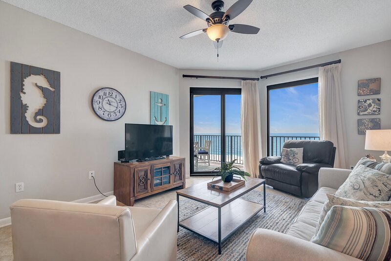 Spacious Living Room with Comfortable Seating and Balcony Access