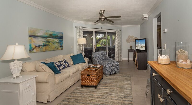 fully furnished living room with patio access new smyrna beach vacation rental