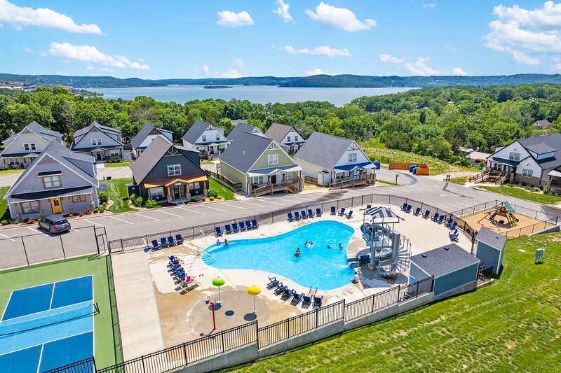 Branson Cove Outdoor Amenities- Seasonal Pool With Splash Pad & Water Slide, Fenced Playground, Pickle Ball Courts